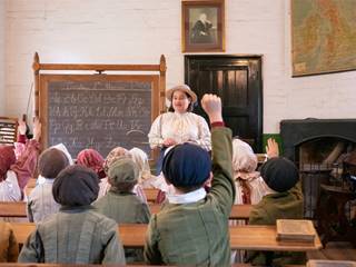 Victorian teacher leading a traditional school lesson
