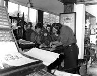 School children watching a print demonstration. 1975