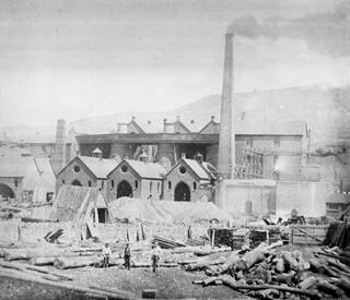 Blists Hill blast furnaces during the time that they were nearing their peak production, 1860s. The three men in the foreground give a sense of scale to size of these works.