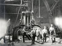 Workers operating a steam hammer at the Coalbrookdale Company foundry, 1870.
