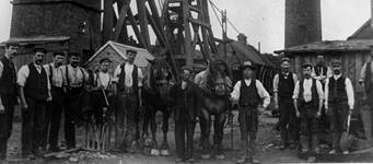 Photograph of male workers and horses outside Madeley Wood Company’s Kemberton Colliery, c.1900.
