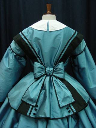 Reproduction fashionable dress 1850s worn by costumed staff.JPG