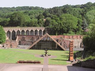 A view over the Coalbrookdale Museum complex. The railway viaduct, deigned by Isambard Kingdom Brunel can be seen in the distance. The centre of the image focusses on the pyramid cover building over Abraham Darby's Old Furnace.