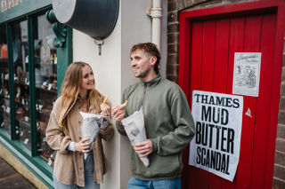 Couple eating chips at Blists Hill Victorian Town