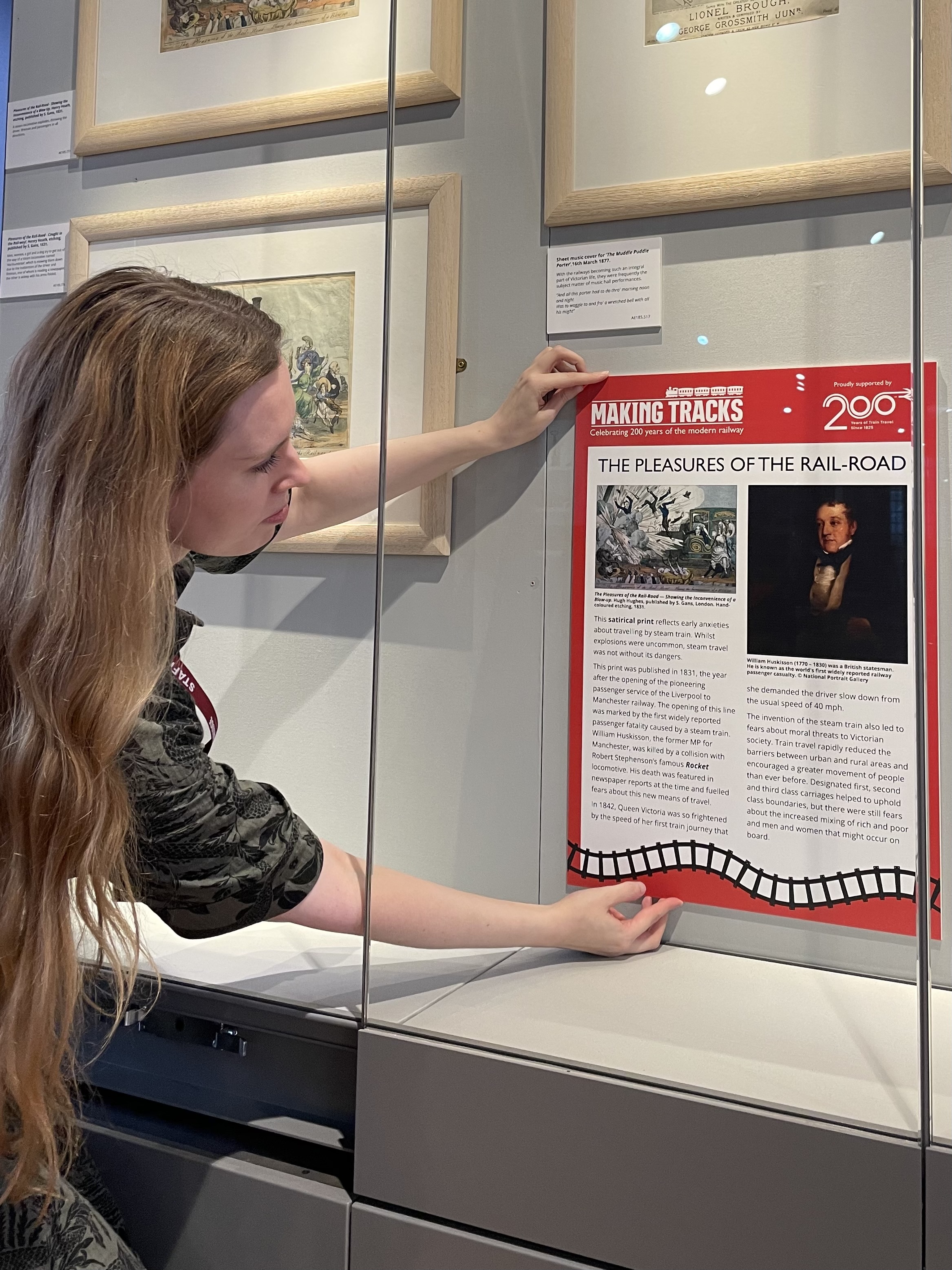 Kyla Hislop, Acting Head Of Interpretation, Installing A Panel Of Making Tracks